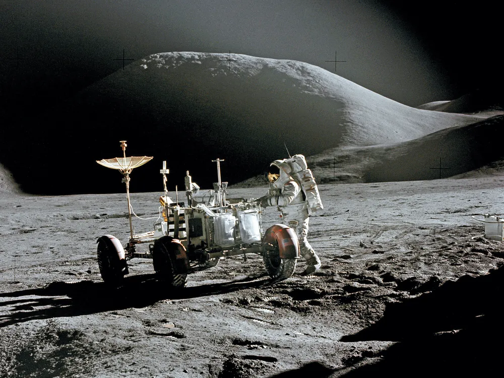 Jim Irwin and rover on moon