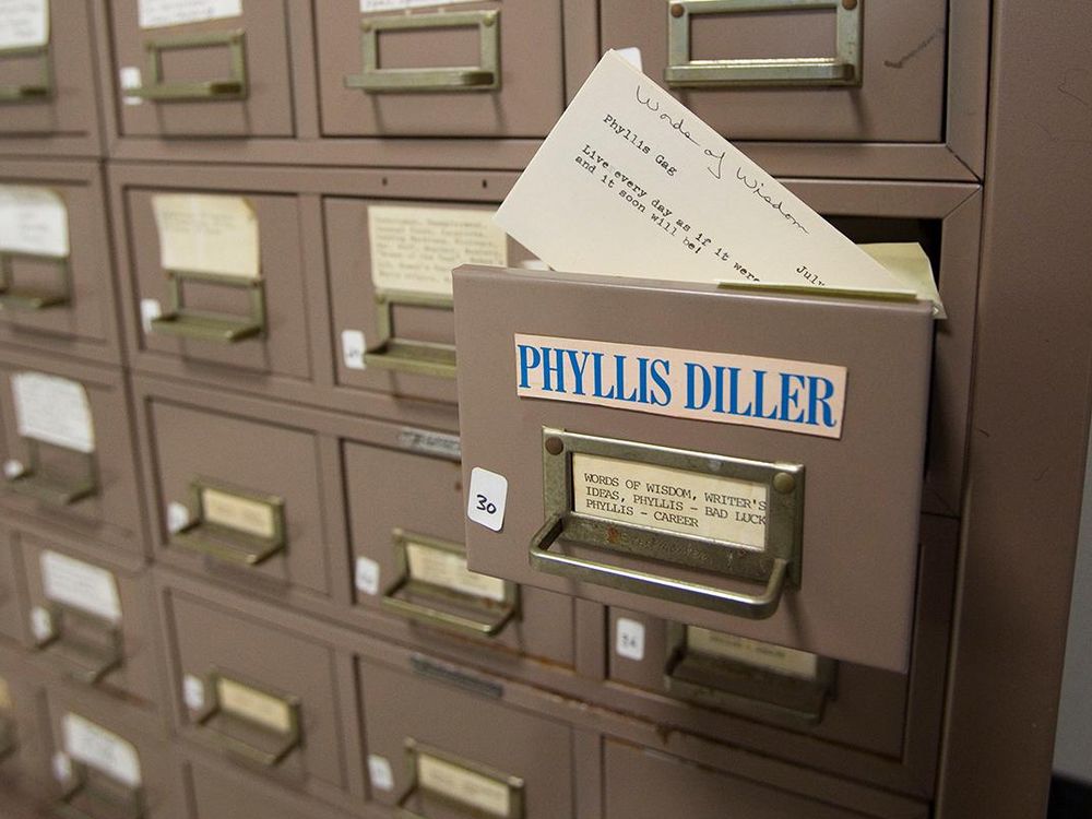 Close up of a card index file with a drawer pulled out. A label on the top reads Phyllis Diller while the contents slot reads Words of Wisdom, Writer's Ideas, Phyllis - Bad Luck Phyllis - Career