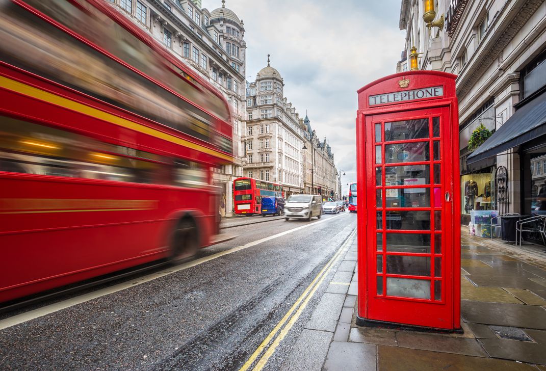 Two iconic London sights:  a double-decker bus and a phone box