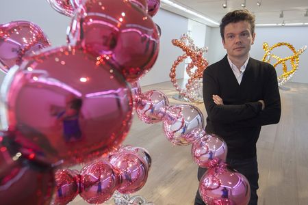 French artist Jean-Michel Othoniel with some of his works in Hong Kong, May 2014. The sculptures he is designing for Versailles have a similar pearl-strand shape. 