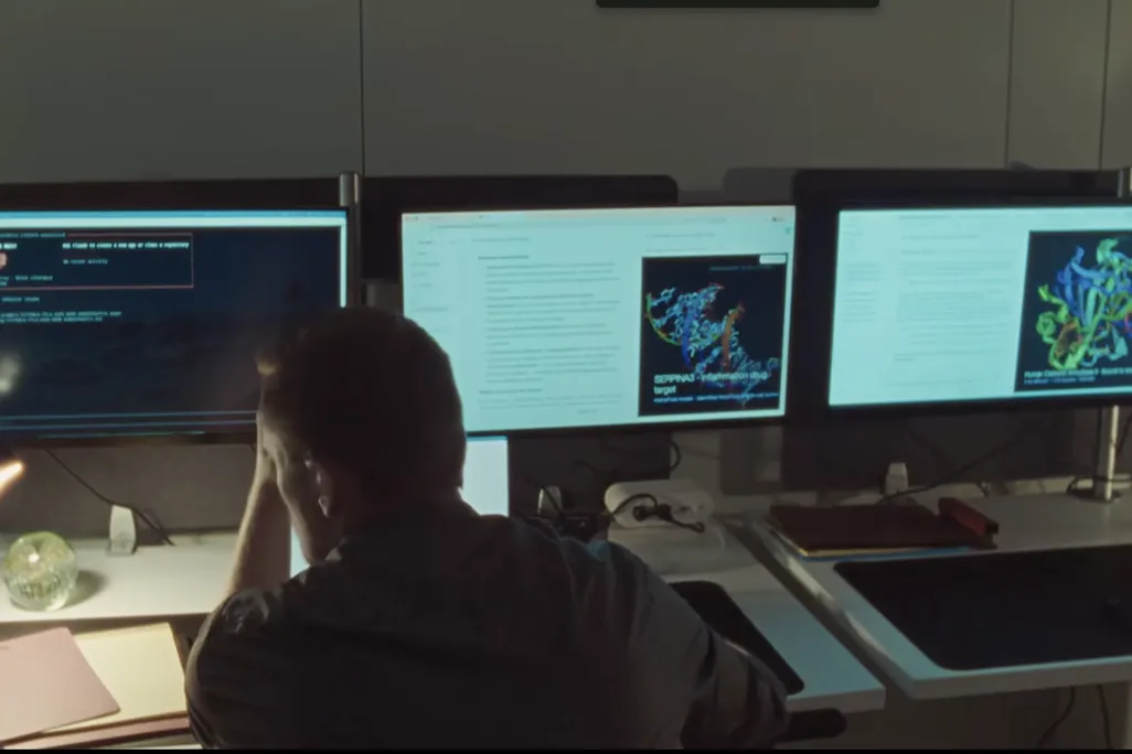 scientist in front of computer screens