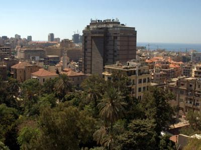 View of Beirut, Lebanon, with palm and pine trees in the foreground