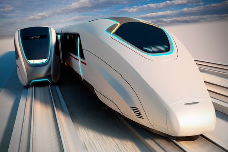 The tracks and individual cabins of a new train would be built so that, as the high-speed and local train move alongside each other, a link can be secured momentarily, creating a transfer gate for passengers to get on and off. 