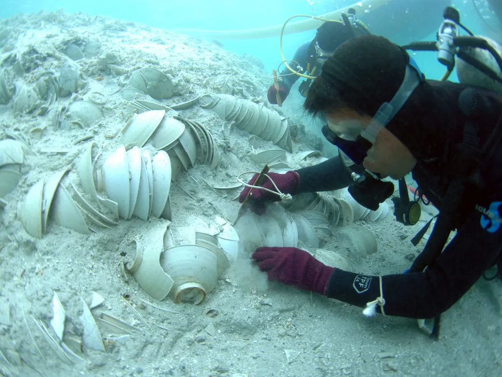 Divers excavating the 12th-century Huaguangjiao One wreck uncover stacked Song dynasty bowls.
