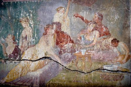 The smooching couple in the center left gave the bakery its nickname.