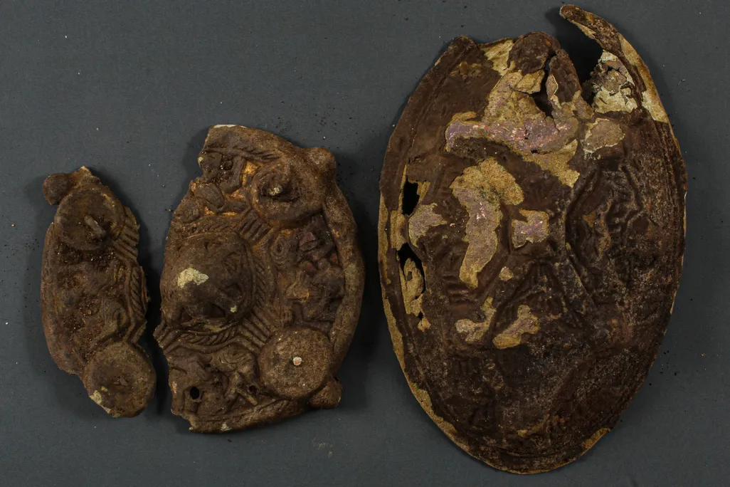 Two Viking artifacts with measurement marker underneath