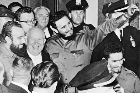 Soviet Premier Nikita Khrushchev, left, and Cuban President Fidel Castro, center, are seen outside the Hotel Theresa in the Harlem neighborhood of New York.