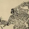 Detail of album cover with black print of a warrior figure in profile wearing a feathered crown and armor.