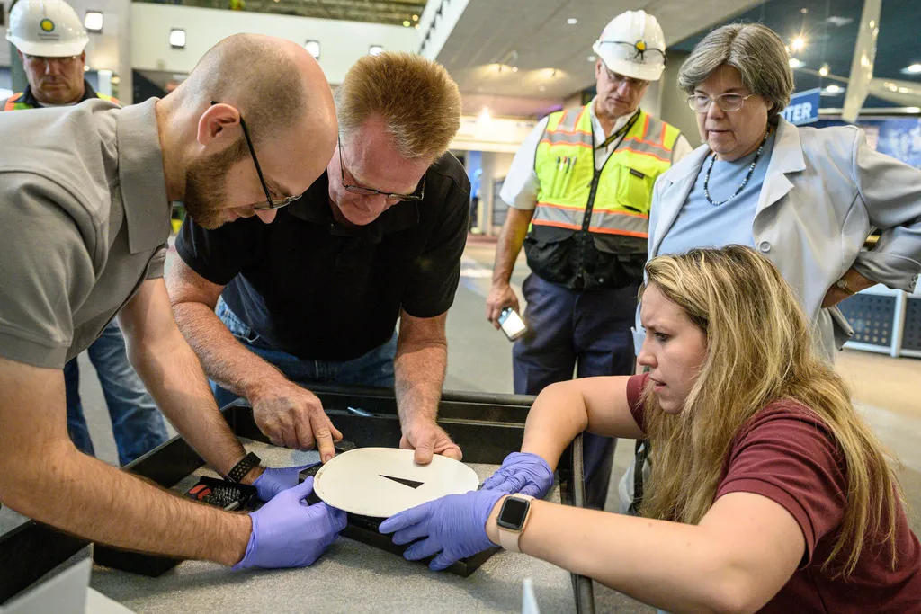 inspecting the moon rock