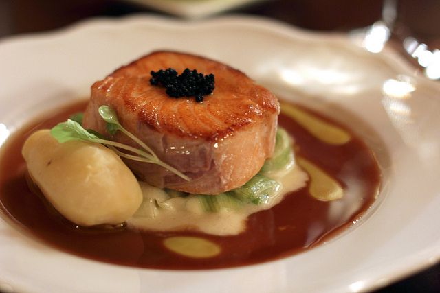 Seared Atlantic salmon with sturgeon caviar, braised leeks and pureed potato.