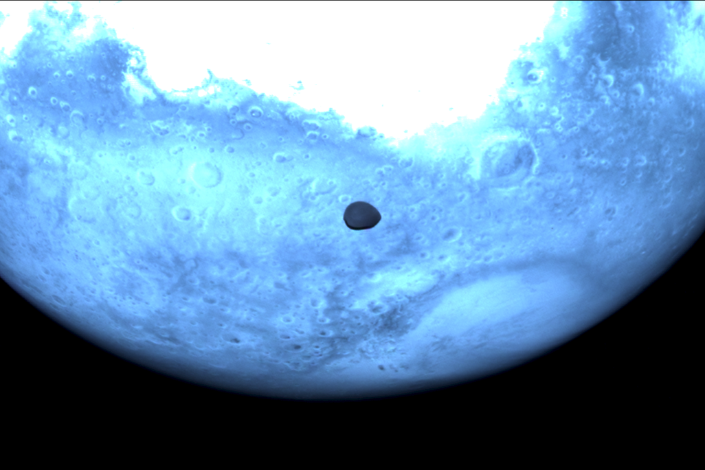 Light blue Mars and very small dark Deimos viewed by Hera's Hyperscout H