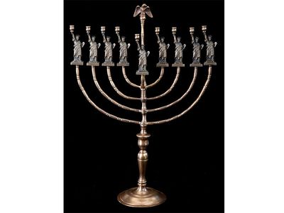 This menorah made by Manfred Anson (1922-2012), an immigrant to the United States celebrates American and Jewish traditions. 


