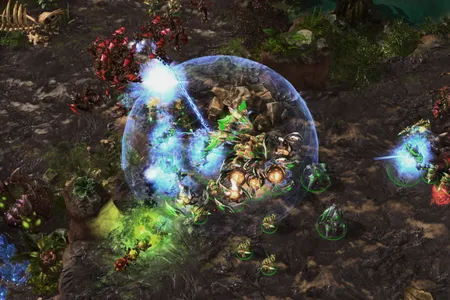 AlphaStar, playing as the StarCraft race Protoss, in green, dealing with flying units from the Zerg players with a combination of powerful anti-air units. The AI program mastered all three races in the game, Protoss, Terran and Zerg.