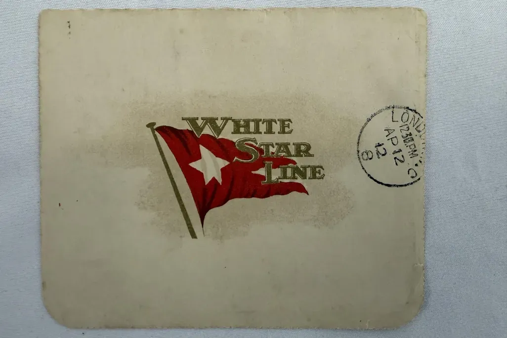 White Star Line logo with red flag on white envelope