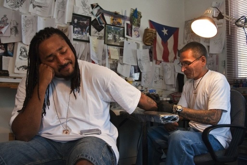 Q Monts sits patiently at Nu Flava Ink