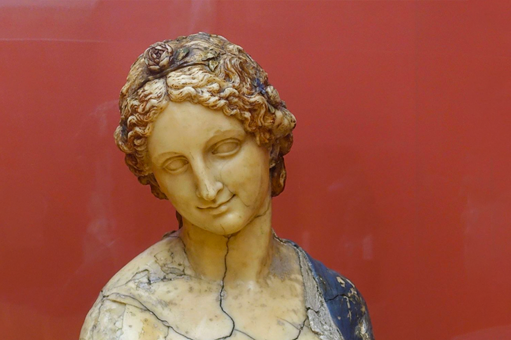 Flora bust in front of red background