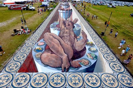 This gigantic piece of chalk art was created by dozens of artists in attempt to snag a Guinness World Record for Largest Anamorphic Pavement Art. 