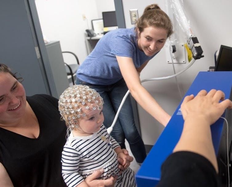 EEG caps let researchers record infant volunteers’ brain activity.