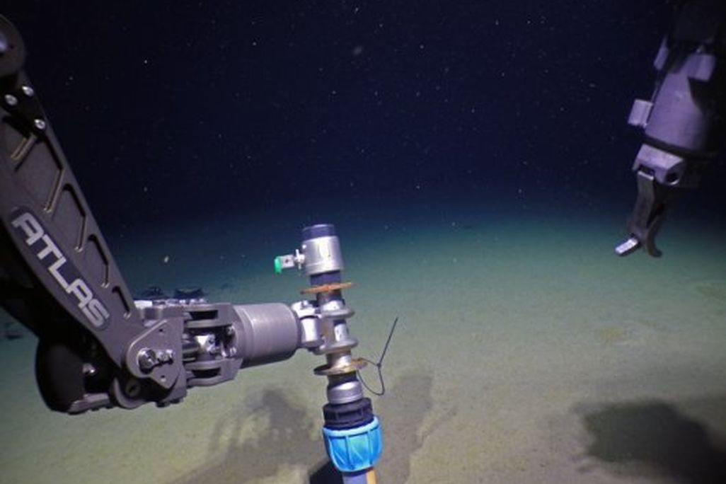 View from deep sea research vessel of sediment coring device on the bottom of the Arctic Ocean
