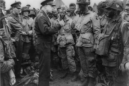 Gen. Dwight D. Eisenhower gives the order of the day: "Full victory—nothing else" to paratroopers in England, just before they board their airplanes to participate in the first assault in the invasion of the continent of Europe.
