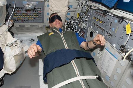 Greg Johnson, asleep during the STS-125 mission.
