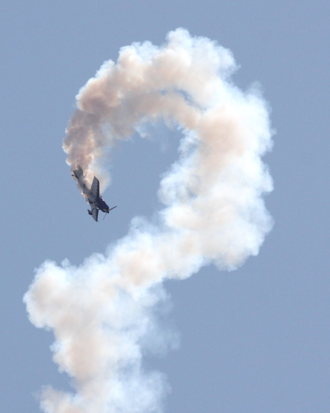 Stunt plane performs an a low altitude inversion. Smithsonian Photo