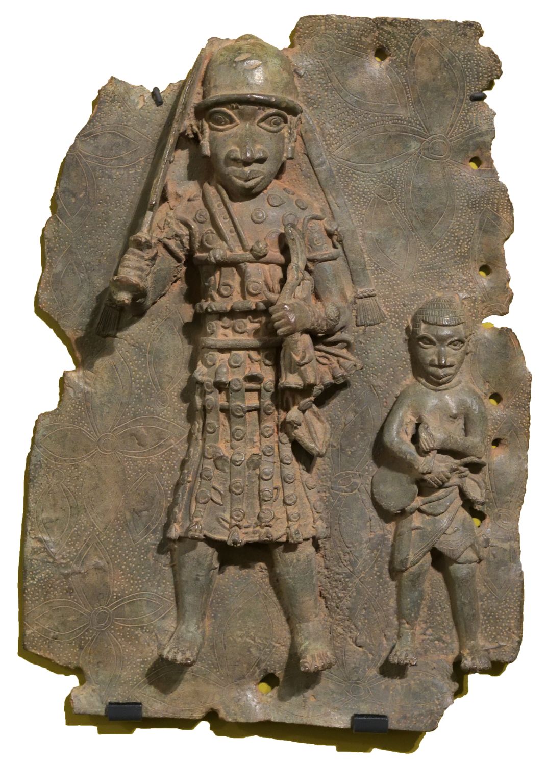 A Benin Bronze plaque of an Edo dignitary in ceremonial dress and an attendant