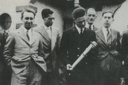 Arthur C. Clarke (far right) and other members of the British Interplanetary Society had a visit from rocket pioneer Robert Truax (holding the rocket model) in 1938.