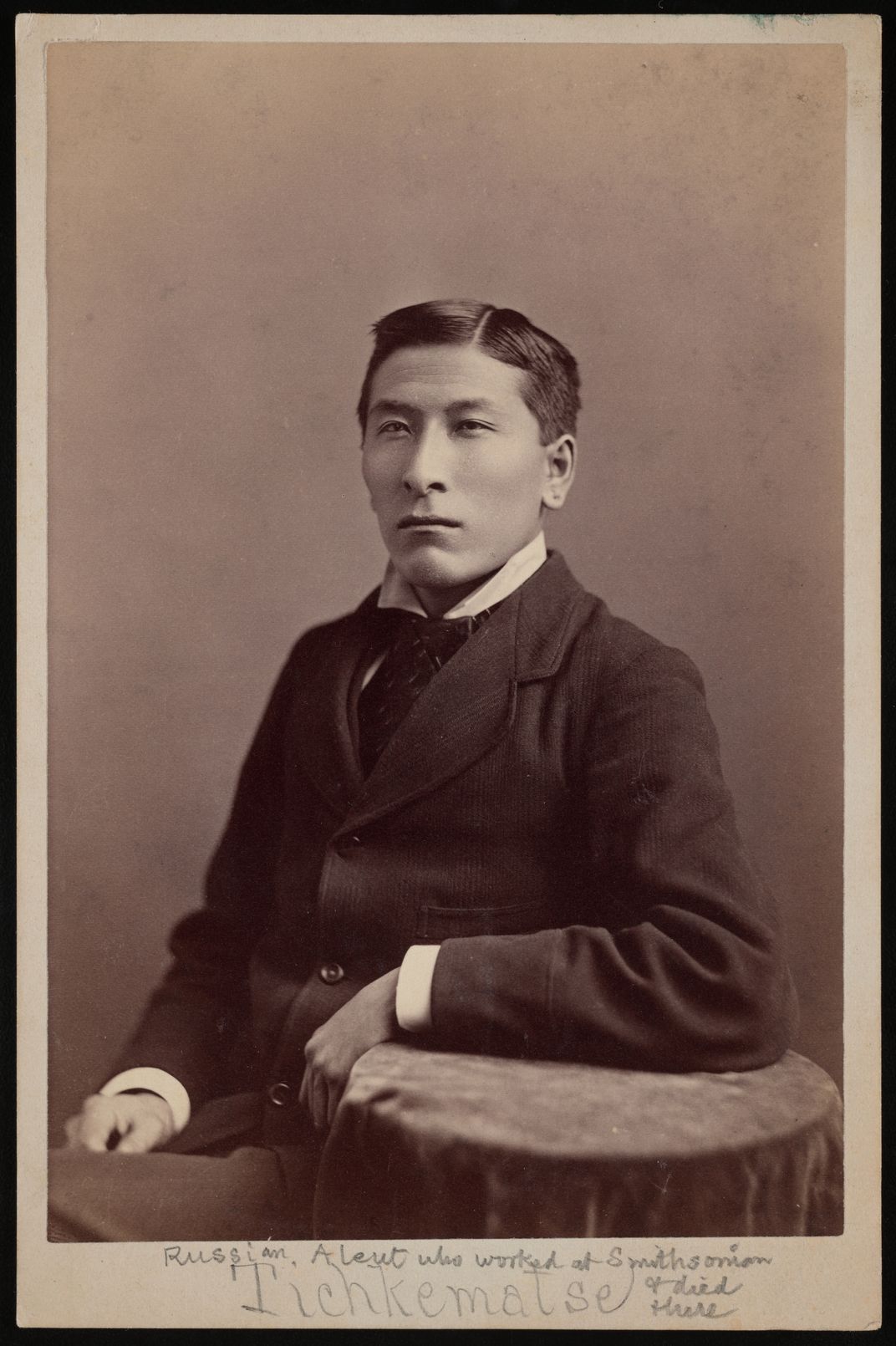 Late 19th century photographic portrait of man in suit.