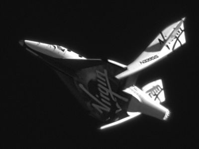 SpaceShipTwo shows its characteristic “wing feathering” in a gliding test over Mojave, California in May 2011. 