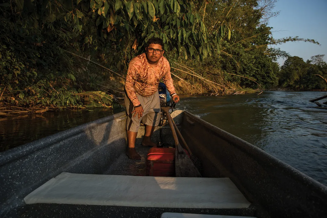 Yamit Diaz Romero, a fisherman turned hippo-tour guide, on the Claro Cocorná Sur River, a tributary of the Magdalena, near Doradal