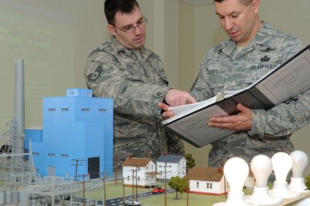 U.S. Air Force Staff Sgt. Christopher Judge, left, and Master Sgt. Manuel Matute conduct a final check on industrial control systems (ICS) equipment to verify results of their first ICS exercise during the enlisted portion of undergraduate cyberspace defense operations training at Keesler Air Force Base, Miss., Jan. 24, 2011. The 333rd Training Squadron is responsible for providing the initial skills for the new Air Force Specialty Code, 1B4X1, cyber defense operations. Judge is a cyberspace defense operations instructor; Matute is a cyberspace defense operations instructor supervisor. (U.S. Air Force photo by Kemberly Groue/Released)