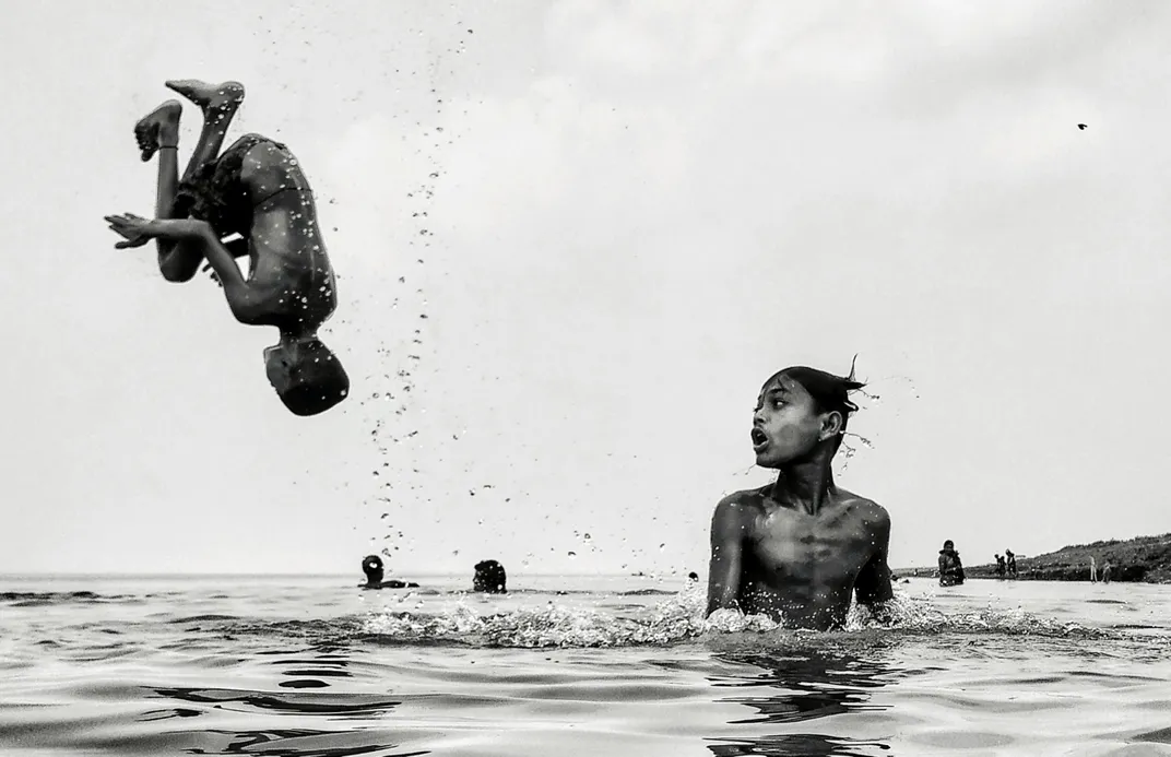 Kids jump into water