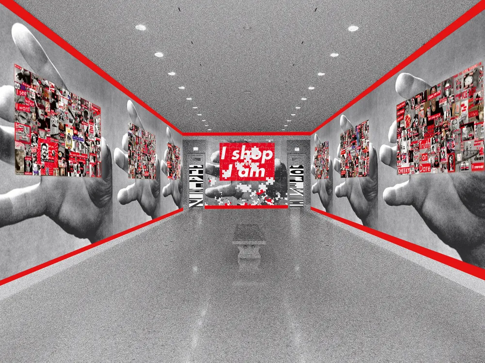 An installation view of a long hallway with gray floors, walls outlined in red