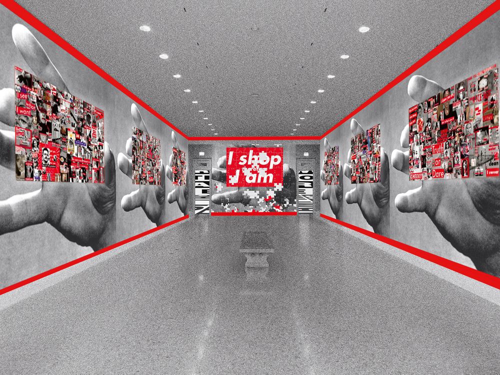 An installation view of a long hallway with gray floors, walls outlined in red