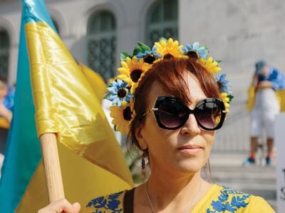 Adorned in the blue and yellow of the Ukrainian flag, Victoria Franco takes part in a protest near Los Angeles City Hall on March 19, weeks after Russia invaded Ukraine.