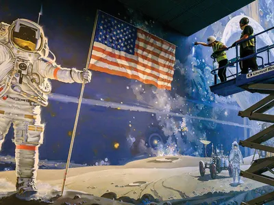The Museum’s murals were taken down in sections; here, a contractor identifies the canvas seams on Robert McCall’s A Cosmic View.