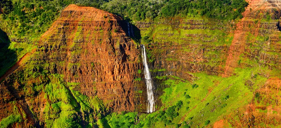  View of a waterfall hiking Waimea Canyon, Kauai 