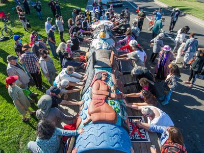 Members of the public take part in a blessing of the Lummi Nation totem pole in San Leandro, California, on June 3. The House of Tears Carvers toured the pole around the West Coast before embarking on a two-week journey to Washington, D.C. 