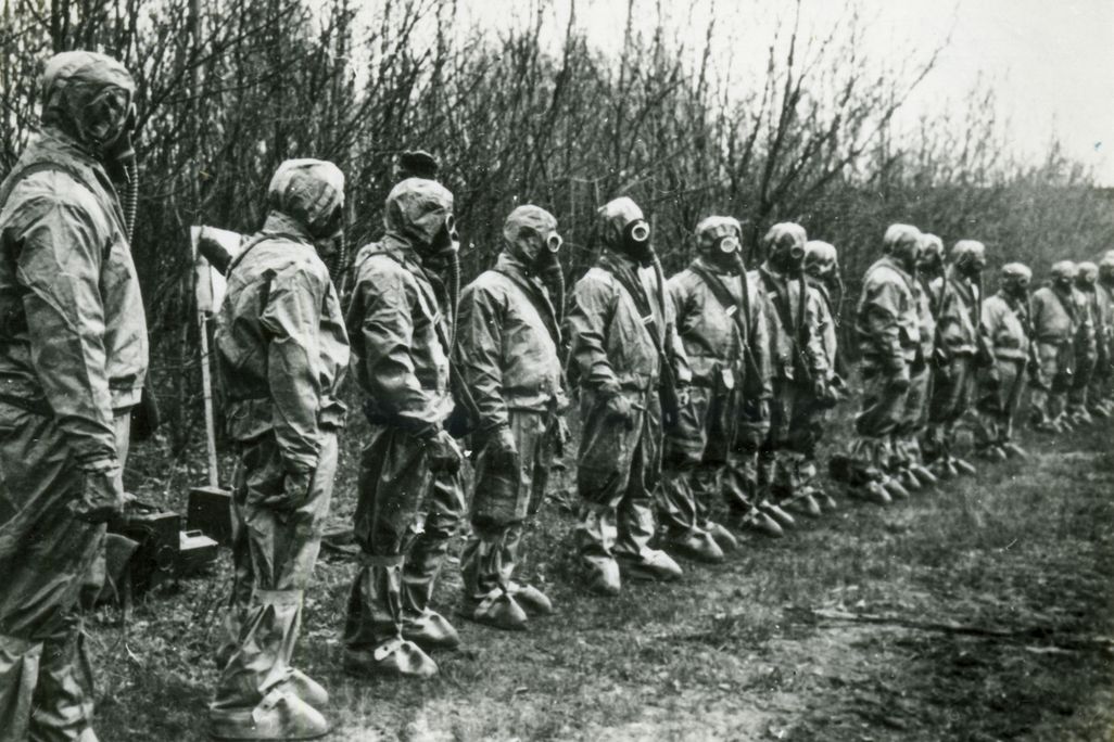 Masked liquidators in line to deal with the Chernobyl plant disaster