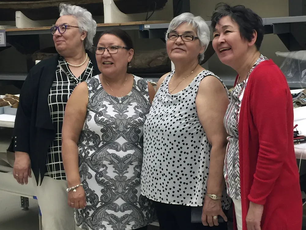 Manitok Thompson, Veronica Connelly, Rosie Kowna Oolooyuk, and Bernadette Dean at the National Museum of the American Indian's Cultural Resources Center. The four women—skilled caribou and sealskin clothing makers, and fluent Inuktitut-speakers and knowledge keepers—traveled to Washington from Nunavut as guests of the Embassy of Canada to attend the opening of the embassy's exhibition 