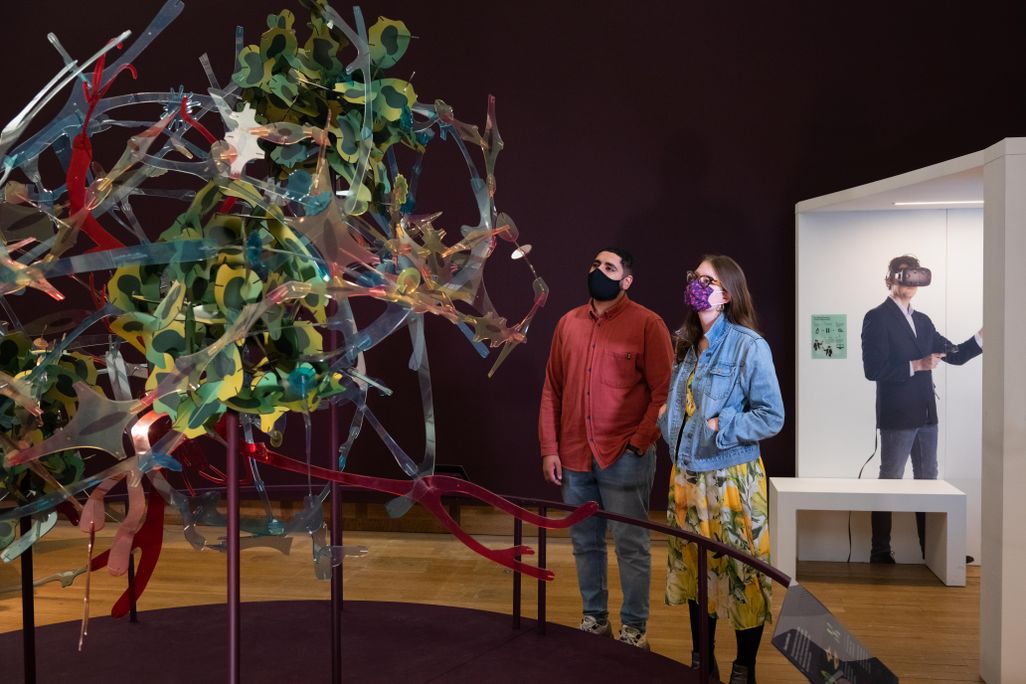 Visitors looking at sculpture by Skellon Studio in Cancer Revolution at the Science Museum.