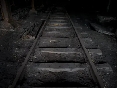 Railway tracks lead into a dark underground shaft in a former mine in Walbrzych, Poland near where amateur treasure hunters say they have found a lost Nazi train full of gold.