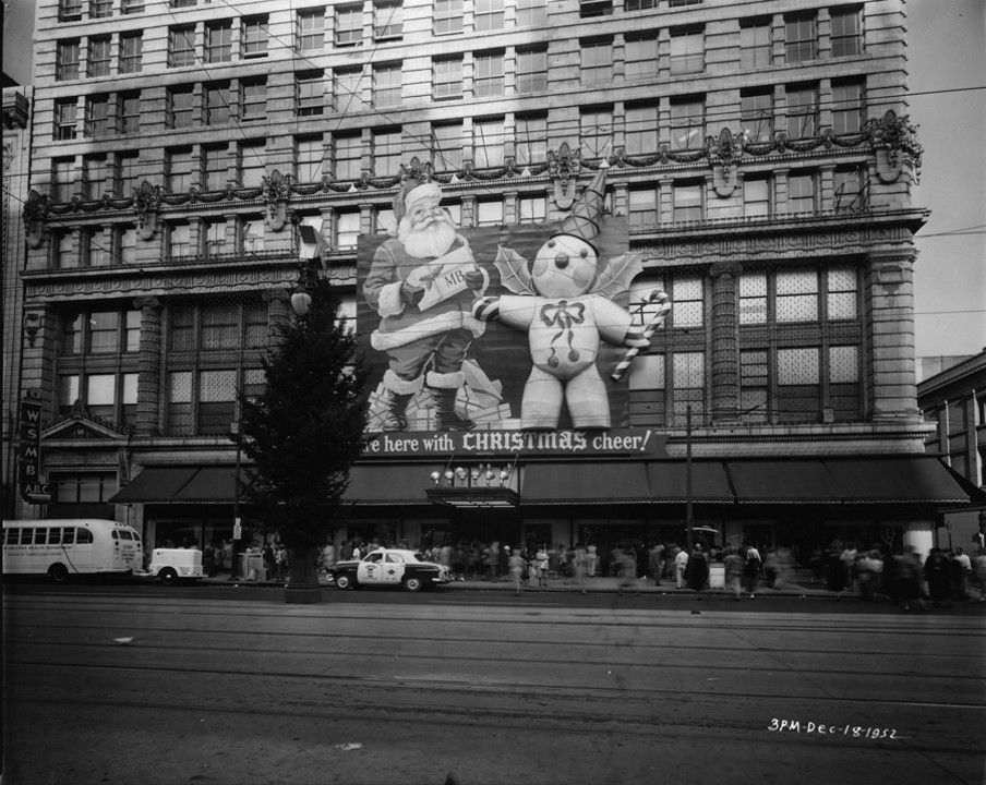 A December 1952 photograph of the Maison Blanche store in New Orleans, with a three-story high Santa Claus and Mr. Bingle affixed to the facade