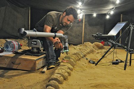 Vince Rossi wields a laser to document a whale fossil in Chile.