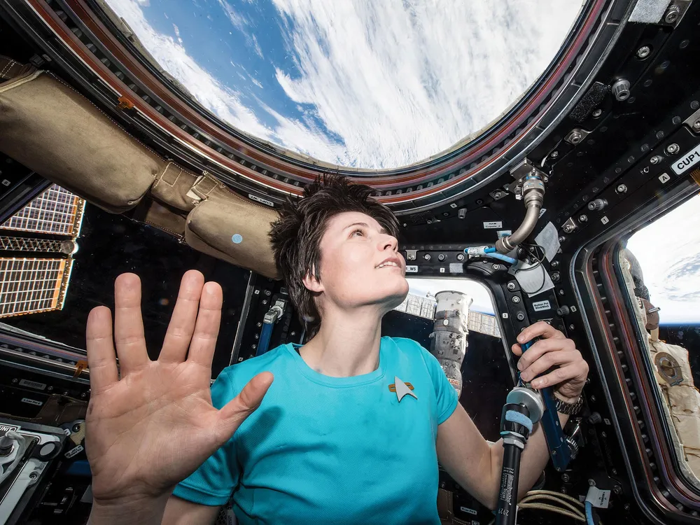 astronaut in space giving Vulcan salute