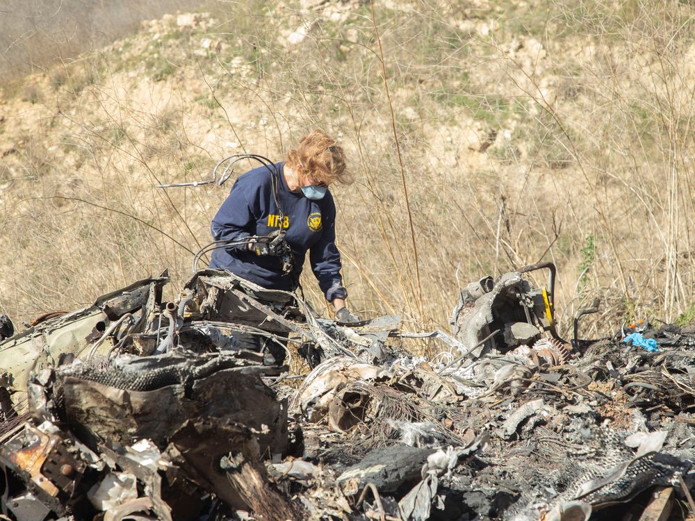 worker at a helicopter crash site