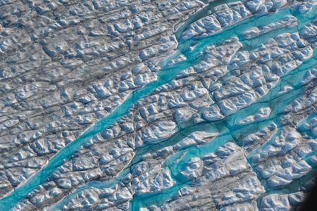 An aerial view of meltwater rivers carving into the Greenland ice sheet on August 04, 2019.
