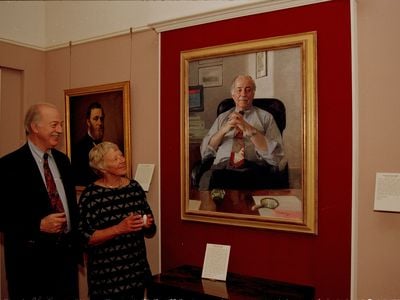 Secretary Adams and his wife Ruth contemplate his official portrait, which to this day resides at the Smithsonian Institution "Castle" Building.