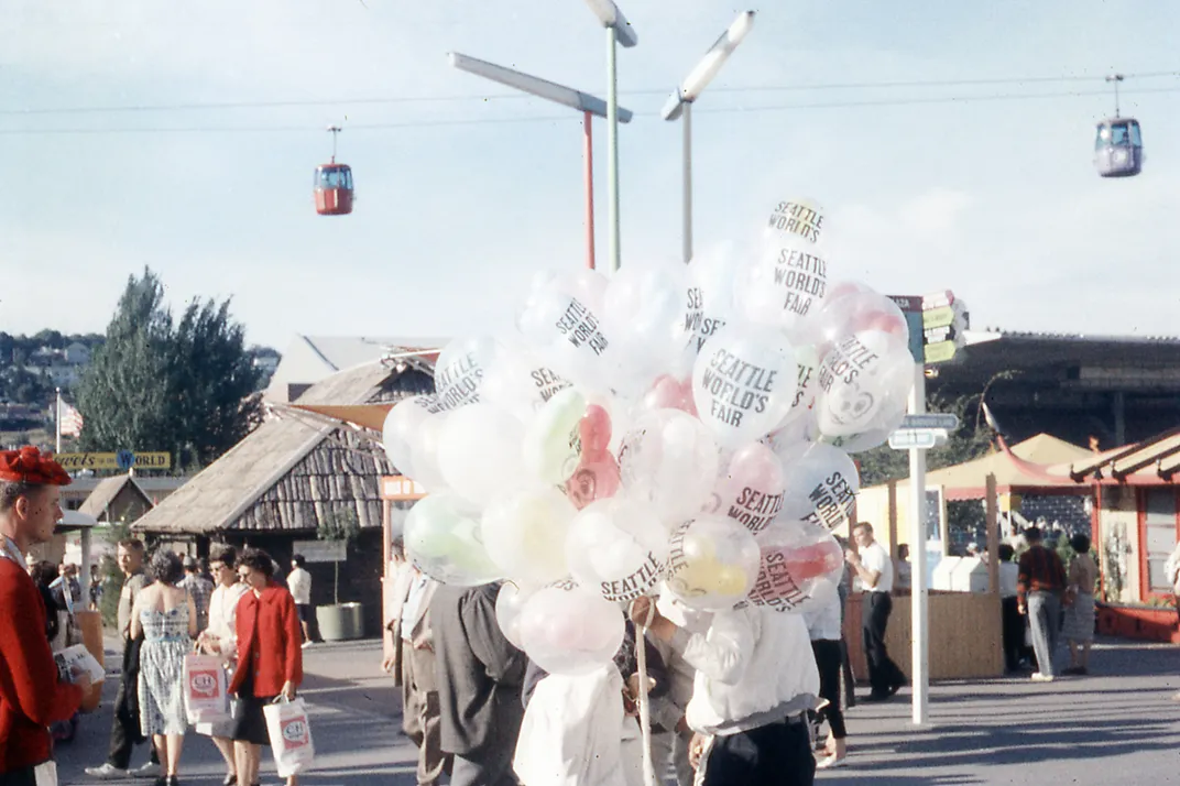 A vendor sells balloons to visitors at the Century 21 Exposition in July 1962.